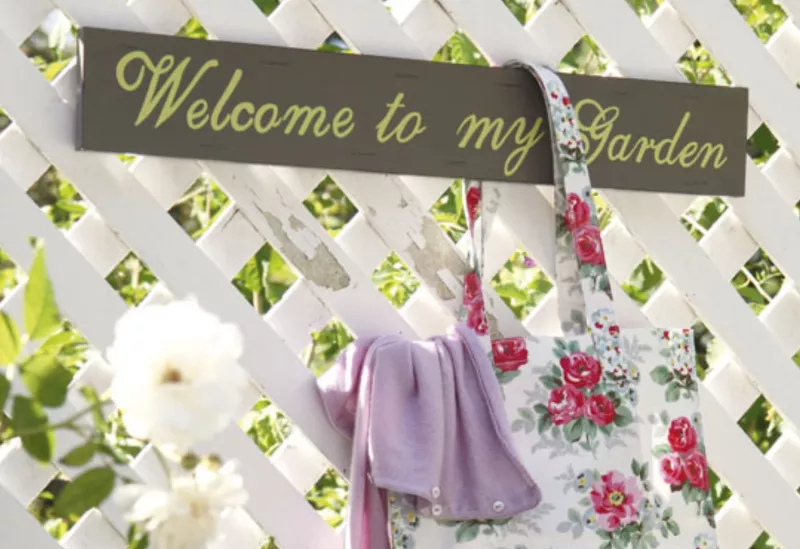 Welcome sign in a vintage garden