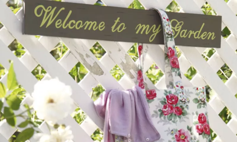 Welcome sign in a vintage garden